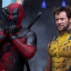 two deadpool characters standing next to each other