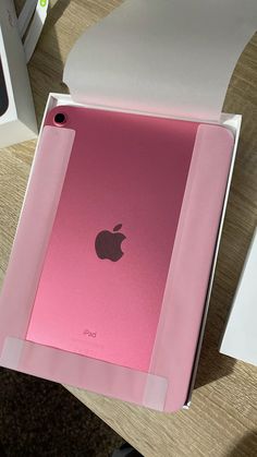 an apple ipad in its box on a table