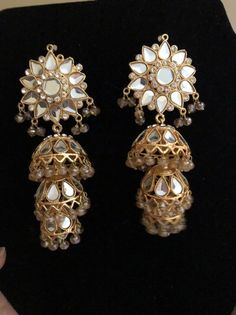 Elegant Kundan Jhumkas With Gota Work, Elegant Jhumkas With Gota Work, Elegant Jhumkas With Gota Work For Diwali, Elegant Dangle Tikka For Festivals, Elegant Festive Jhumkas With Gota Work, Elegant Chandbali Jhumkas With Gota Work, Elegant Chandbalis With Gota Work For Celebrations, Celebration Bridal Earrings With Stone Work, Gold Kundan Dangle Jhumkas