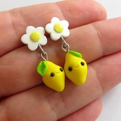 A little pair of bright lemon earrings. A very beautiful piece of handmade jewelry which has been handmade with polymer clay by myself, they are completely adorable! Nice gift for anyone! - Earring hooks and metal elements are stainless steel - Earrings measure 3 cm long  I love to making custom orders! I'll work with you to make something completely unique and exactly how you want it; this includes shape, size and color that you adore. Let me know what you like and I'll do it.  Perfect for uniq Cute Clay Drop Earrings, Handmade Yellow Polymer Clay Earrings, Yellow Polymer Clay Jewelry For Gifts, Yellow Polymer Clay Earrings With Ear Wire, Cute Handmade Yellow Earrings, Cute Yellow Hypoallergenic Jewelry, Handmade Lemon Color Dangle Jewelry, Handmade Yellow Polymer Clay Jewelry, Cute Handmade Yellow Jewelry