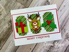 a christmas card with the words merry christmas written in red, green and white paper