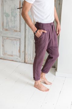 "Linen drop-crotch pants for men are a part of your casual outfit or any specific occasion. A loose cut around the thigh with a narrow shape through the leg feels very comfortable even during the hottest days. The above ankle length of the pants looks good with sandals as well as sneakers. These stylish pleated pants have four pockets - one at each side and two in the back. You will be beloved to wear them! DETAILS: - OEKO-TEX certified product (Sustainable Textile) - Zip fly with two buttons cl Engagement Photo Outfits For Men Summer, Cuffed Pants Men, Linen Pleated Pants, Bohemian Linen Bottoms With Pockets, Bohemian Relaxed Fit Straight Leg Pants, Bohemian Straight Leg Pants With Relaxed Fit, Bohemian Straight Leg Bottoms With Pockets, Bohemian Straight Leg Relaxed Pants, Bohemian Bottoms With Relaxed Fit And Tapered Leg