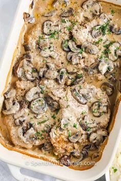 a casserole dish filled with chicken and mushrooms