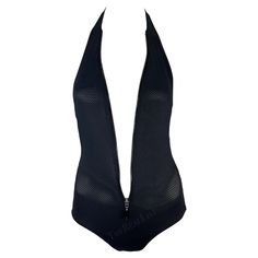 Presenting an ultra-sexy black mesh Gucci one-piece swimsuit, designed by Tom Ford. From the Spring/Summer 2002 collection, this mesh one-piece features a halter neck and zipper that runs downs the front. The zipper runs down to just above the hip which can create a plunging neckline or a more covered-up look. This hot one-piece is a must-have for any Gucci by Tom Ford lover. Approximate measurements: Size - S Bust: free Waist: 26 - 32" Hips: 30 - 40" 86% nylon, 14% elastane Gucci Swimwear, Swimsuits Vintage, Designer Bathing Suits, Gucci By Tom Ford, Halter One Piece Swimsuit, Costume Intero, Designer Swimwear, Look Plus, Black Mesh