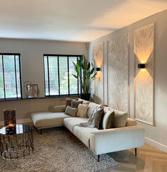 a living room filled with furniture and windows