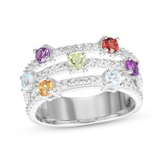 a multicolored ring with white gold and diamonds