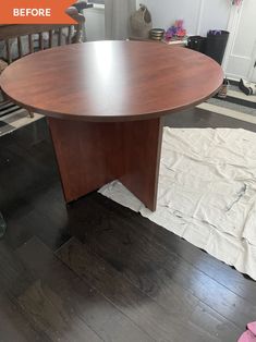 a wooden table sitting on top of a hard wood floor