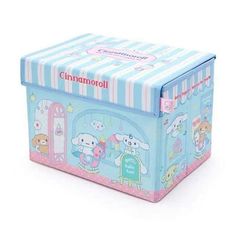 a blue and pink box with cartoon characters on the front, sitting on a white surface