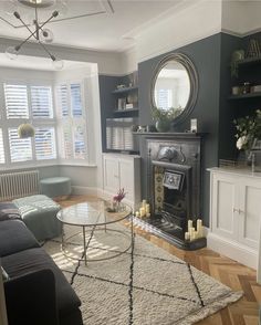 a living room filled with furniture and a fire place