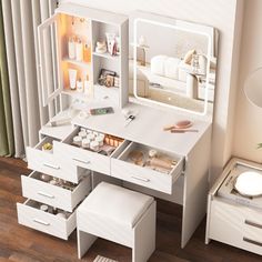 a white dressing table with drawers and stools