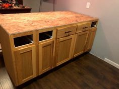 a kitchen island made out of plywood with two glass inserts on the top