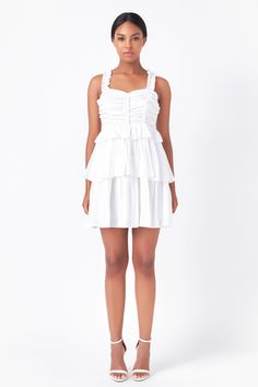 The perfect party dress for your next night out. This stunning corset mini dress is sure to turn heads. With its pretty ruffles and alluring side zipper, it's perfect for making a statement. Whether you're dressing up or dressing down, this versatile piece is a must-have in every girl's wardrobe. Ruched corset Ruffled shoulder straps Double ruffle bottom Mini length Lining Side zipper Hand wash cold Do not bleach Do not tumble dry Iron low Shell: 75% Cotton 25% Nylon Lining: 100% Polyester HN698 Corset Mini Dress, Grad Dresses, Girls Wardrobe, Perfect Party, White Mini Dress, Every Girl, Dressed Down, Shoulder Straps, Side Zipper