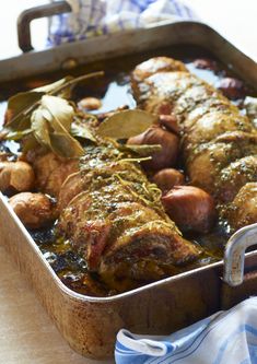 a casserole dish with meat and vegetables in it