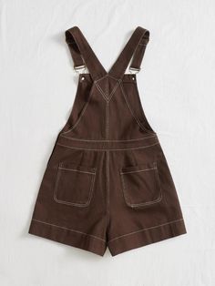 The Slant Pocket Romper is perfect for a stylish and professional look. This romper features a brown woven fabric with an overall style and slanted side pockets for added convenience. It has adjustable straps, a button closure, patched details, and a regular fit to flatter your figure. The high waistline offers additional comfort while the non-stretch cotton material provides durability. Wear this romper for any occasion and look polished yet effortless! Specifications: Color: Brown Details: Button, Patched, Pocket Sleeve Length: Sleeveless Neckline: Straps Fit Type: Regular Fit Waist Line: High Waist Fabric: Non-Stretch Material: Woven Fabric Composition: 100% Cotton Care Instructions: Machine wash or professional dry clean Product Measurements(cm): Size US Bust Hip Size Inseam Length Thi Overall Style, Look Polished, Professional Look, Stretch Cotton, Woven Fabric, Cotton Material, Adjustable Straps, Overalls, High Waist