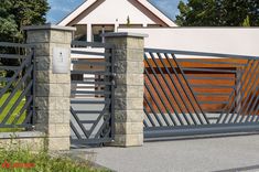 a modern gated entrance to a house