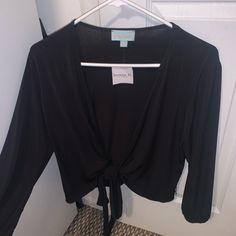 Black Long Sleeve Tie Front Shirt Size Medium Never Worn With Tags Perfect Condition Could Be Also Tied Around The Waist Long Sleeve Black Blouse For Brunch, Black Long Sleeve Blouse For Brunch, Black Blouse For Brunch In Fall, Versatile Black Blouse For Day Out, Casual V-neck Shirt For Night Out, Casual Solid Color Shirt For Night Out, Casual Solid Shirt For Night Out, Versatile Black Fall Shirt, Trendy Black Blouse For Brunch