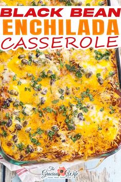 black bean enchilada casserole in a glass dish on a wooden table