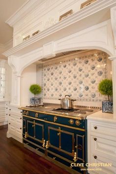 an ornate kitchen with blue and gold accents