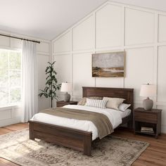 a bedroom with white walls and wood furniture