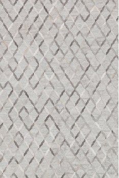 an area rug with grey and white patterns