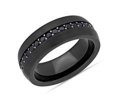 a wedding band with black diamonds on it