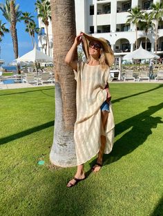 Whether you will wear it as an over-bikini cover-up, or as a dress on its own, you will be able to achieve an elevated look with our Collette Kaftan. Delicate and sophisticated, this linen kaftan will be a perfect fit at a resort by the sea, or at any poolside setting. You can also wear it as a tunic over a slip dress, shorts and even jeans. Collette Kaftan is one size. Due to its breathable transparency, you can purchase it together with our Leah cotton slip dress, that is available in sizes S, Beachy Dresses For Sunbathing Vacation, Beachwear Beige Beach Dress For Day Out, Beige Beach Dress For Day Out, Beige Beachwear Dress For Day Out, Summer Beach Linen Dress With Short Sleeves, Beige Beachwear Dress For Beach, Summer Linen Dress With Short Sleeves For Beach, Summer Dresses For Sunbathing In Spring, Chic Summer Vacation Tunic