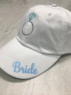 Wedding party hats! *Adams six panel low profile hat *Leather adjustable strap *Embroidered champagne bottle on bridesmaids hat *Embroidered ring on brides hat *printed Wording on rim of Hat *Custom wording is available Contact us with any special request. Bridesmaid Hats, White Cap Mini Hat For Weddings, White Wedding Hat (one Size Fits Most), White Wedding Hats One Size Fits Most, Bridesmaids Hats, Personalized Adjustable Hats For Wedding, Adjustable White Mini Hats For Bachelorette Party, Adjustable White Hat For Anniversary, White Wedding Hat, One Size Fits Most