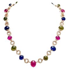 Bochic "Capri” Ruby & Multi Color Sapphire Necklace In 18K Gold & Silver Beautiful necklace with Classic Italian sensibility Green Sapphire - 5 Carats Blue Sapphire - 7 Carats Red Ruby - 9 Carats White Topaz - 4 Carats The Bochic "Capri" Opal & Multi Fancy Gems Necklace is Set in 18K Gold & Silver is a stunning piece of jewelry designed for versatility and elegance. It features natural gems cabochons weighing 25 carats, showcasing red, blue, and green tones. The Necklace also includes natural multi-color fancy Gems. Crafted in 18K gold and 950 silver, this necklace is a combination of luxury and craftsmanship. The piece is designed to disassemble and can be worn as pendants or brooches, thanks to its open and close clasp and safety hook. It is ideal for transitioning from day to night, mak Gems Necklace, Multi Coloured Necklaces, Thai Art, Gem Necklace, Green Sapphire, Green Tones, Sapphire Necklace, Classic Italian, Red Ruby