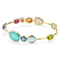 Color is the defining feature of this 18K gold bangle, each stone is deeply hued and hand-faceted to intensify its richness. The prong and bezel-set gems adorning its surface include dark amethyst, rock crystal, mother-of-pearl, lapis, peridot, Swiss blue topaz, and a triplet of mother-of-pearl layered above and below amethyst. Wear it to enhance the vibrancy of any bracelet stack. • 18K Gold • Gemstones: Dark Amethyst, Rock Crystal, Mother-of-Pearl, Lapis, Peridot, Swiss Blue Topaz, Clear Quart Ippolita Jewelry, Amethyst Rock, 18k Gold Bangle, Dark Amethyst, Rainbow Gemstones, Stone Bangle, Bangles Jewelry Designs, Rock Candy, Gold Bangle