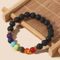 Elevate your senses with our beautiful Chakra Lava Rock Bracelet Diffuser. This essential oil diffuser bracelet combines the energy protection of lava stones with the soothing benefits of aromatherapy, creating a practical and spiritual bracelet. Our Lava Rock Bracelet features seven mixed chakra stones, each one chosen to align and balance your chakra system. The 7 stones help to clear energy blockages and promote the free flow of energy. One of the unique features of this Chakra essential oil Chakra Bracelet Meaning, 7 Chakras Bracelet, Chakra Beads Bracelet, 7 Chakra Bracelet, Clear Energy, Spiritual Bracelets, Energy Protection, Lava Rock Bracelet, Essential Oil Bracelet