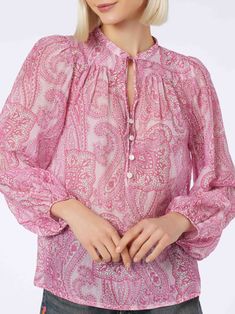 Our oversized-cut Harper blouse features more room around the chest and waist. Its length falls above the hips, ideal for summer wear, paired with our Eivissa mini skirt or with shorts, jeans or trousers. Crafted from cotton and silk, the piece is colored with pink tones and features a paisley cashmere-style print. This product, along with many other MC2 Saint Barth items, is created with an all-over print that falls differently on each garment. Size S has a length of 64 cm, measured from the ce Chic Vacation Tops With Blouson Sleeves, Chic Tops With Blouson Sleeves For Vacation, Long Sleeve Paisley Print Top For Summer, Long Sleeve Tops With Paisley Print For Summer, Chic Paisley Print Top For Day Out, Long Sleeve Paisley Print Top For Day Out, Pink Blouson Sleeve Blouse For Daywear, Pink Blouse With Blouson Sleeves For Daywear, Summer Paisley Print Blouse For Day Out