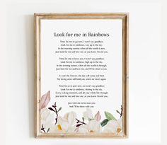 a framed poem with white flowers on the bottom and words below it that read, look for me in rainbows