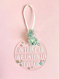 a glass ornament that says in this car we listen to taylor