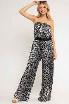 Expertly crafted from high-quality fabric, this Printed Jumpsuit is a stylish and versatile addition to your wardrobe. With its eye-catching print, this jumpsuit is perfect for any occasion - from a casual day out to a formal event. Stay on-trend and effortlessly chic with this must-have piece. - Printed jumpsuit- Strapless- High waistline- Wide leg opening- Cheetah print - Strech satin - Made in U.S.A- Model is 5' 8" 34-24-34 and wearing a Small Style: Casual Print / Pattern: Cheetah print. Silhouette: Wide leg Fit: Regular Neckline: Strapless Lining: No Made In: United States Fabric Contents: 96% Polyester 4% Spandex Stretch fabric. Non-sheer fabric Care Instructions: Machine wash cold, Do not bleach Casual Strapless Jumpsuit For Spring Evenings, Casual Strapless Jumpsuit For Evening In Spring, Casual Strapless Jumpsuit For Evening, Casual Strapless Jumpsuit For Summer Parties, Casual Fitted Strapless Jumpsuit For Evening, Casual Evening Strapless Jumpsuit, Elegant Spring Strapless Stretch Jumpsuit, Black Printed Jumpsuits And Rompers For Party, Casual Jumpsuits And Rompers For Spring Evening