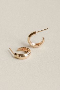 Our smallest Villa Hoop style. A classic shape, with subtle angles and an understated size that gently hugs the earlobe. A perfect every day staple. Our brass and sterling silver Villas have sterling posts and backings, our gold vermeil have 14k gold fill backings and our recycled solid 14k gold Villas have 14k gold posts and backings Hoops are approximately 1/2” in diameter Minimalist Earrings With Timeless Design As Gift, Adjustable Classic Hoop Earrings, Elegant Rounded Tarnish Resistant Earrings, Classic Adjustable Hoop Earrings, Classic Adjustable Hypoallergenic Huggie Earrings, Classic Adjustable Hoop Earrings For Pierced Ears, Minimalist Small Hoop Huggie Earrings For Formal Occasions, Minimalist Round Huggie Earrings, Classic Hypoallergenic Huggie Earrings For Formal Occasions