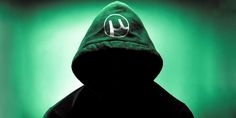 a person wearing a hoodie with the letter y on it in front of a green background