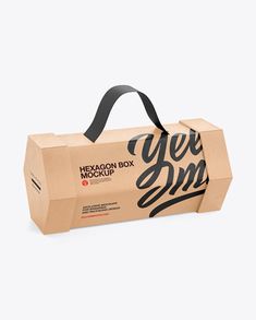 a brown paper bag with black lettering on the front and bottom that says yes box mockup