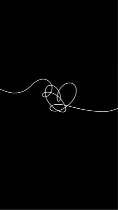 a black and white photo with lines in the shape of a heart on a black background