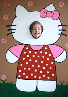 a child's photo in a cardboard hello kitty frame