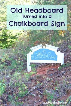 a sign that says old headboard turned into a chalkboard sign in the woods