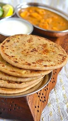 several flat breads are stacked on a plate