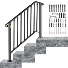 a stair rail with screws and wrenches on the bottom, next to an assortment of tools