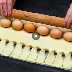 an egg tray with six eggs in it being held by someone's hands over the top