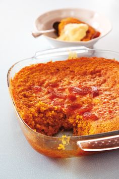 a cake in a glass dish on a table