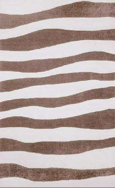 a brown and white rug with wavy lines on it