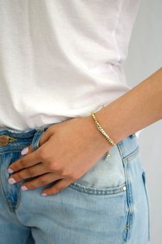 "Bodhi in Sanskrit and Pali means \"awakening\", \"enlightenment\", which puts an end to the cycle of Samsara ( transmigration ) and leads to Nirvana, or Spiritual libration. This one row gold nugget woven bracelet with beige cotton cords reminds the wearer of their spiritual path and joy of awakening, a great wishful gift for love and peace. Bracelet length is adjustable." Spiritual Hypoallergenic Gold Friendship Bracelets, Healing Spiritual Friendship Bracelets, Spiritual Jubilee Beaded Bracelets, Gold Spiritual Friendship Bracelets, Adjustable Gold Beaded Fusion Bracelets, Spiritual Adjustable Bracelets For Everyday, Adjustable Beaded Bracelets For Meditation, Fusion Style Adjustable Bracelets For Meditation, Adjustable Fusion Style Bracelets For Meditation