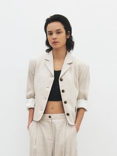 This is a minimal and feminine blazer by MOHAN that is made out of high quality and sturdy fabric. With design detail that gives a trendy and refined mood, you can style it with various items for a clean daily outfit. - Semi cropped silhouette- Classic mood of 4 button closure- Cropped length- Padding on the shoulder Classic Summer Office Wear Blazer, Modern Linen Blazer For Workwear, Modern Linen Blazer For Work, Chic Linen Blazer With Hidden Button Closure, Modern Linen Blazer For Business Casual, Neutral Linen Blazer For Work, Tailored Linen Blazer For Office, Modern Single Button Blazer For Spring, Elegant Linen Blazer With Button Cuffs