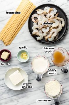 ingredients to make shrimp pasta laid out on a marble counter top with text overlay