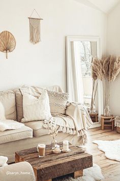 a living room filled with lots of furniture and decor