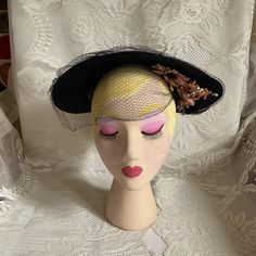 "Vintage 1940's dark Blue hat with Dusty Pink flowers and dark Blue veiling. No makers label or tag. There is a Black hat pin attached to the hat. I will leave it as it is and send it along. It is attached in the back of the hat. *SCROLL DOWN FOR CONDITION & MEASUREMENTS* CONDITION: I not on the INSIDE of the hat where a tag would have been there is a White discoloration. Possibly old glue from the tag (SEE PIX). The veiling does have some splits/tears. On the left side where the flowers are the Dusty Pink Flowers, Blue Veil, 1940s Hats, Pillbox Hat, Hat Pin, Blue Hat, Pill Boxes, Black Hat, Hat Pins